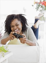 African woman playing video games