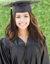 Middle Eastern woman in cap and gown