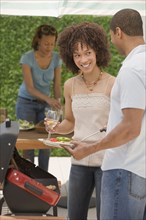 African man and women barbecuing