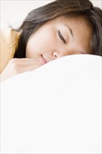 Close up of Asian woman sleeping