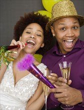 African couple in party hats on New Year's Eve