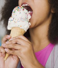 African girl eating ice cream cone