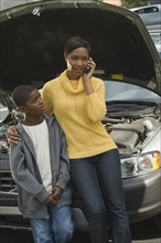 African mother and son having car trouble
