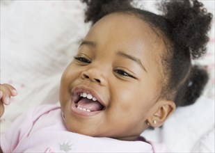 Close up of African American girl laughing