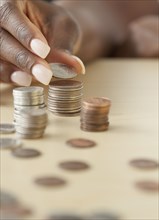 African woman staking quarters