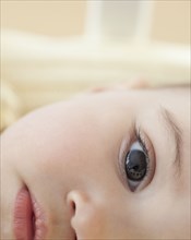 Close up of mixed race baby girl's eye