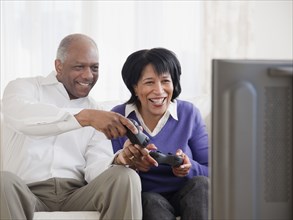 African couple playing video games