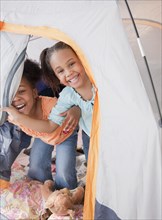 African girls playing in tent