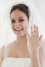 Bride showing off wedding ring