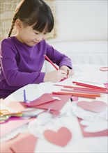 Chinese girl making Valentine's Day cards
