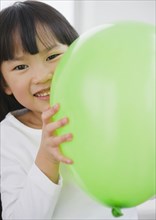 Chinese girl holding balloon