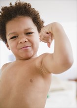 Black boy flexing biceps