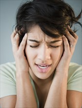Hispanic woman with headache