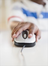 Black boy using computer mouse