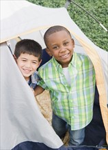 Boys playing in tent