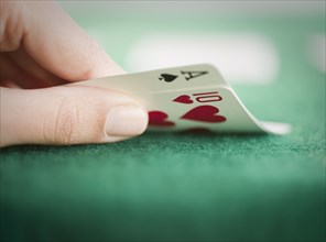 Hand revealing poker cards