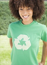 Black woman wearing recycling symbol t-shirt