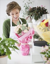 Japanese florist wrapping flower bouquet