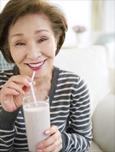 Japanese woman drinking smoothie