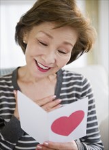 Japanese woman reading valentine card