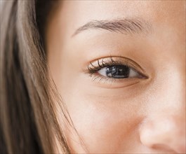 Close up of mixed race teenage girl's eye