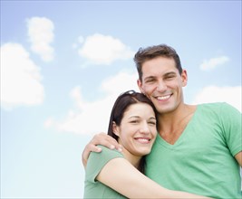 Smiling couple hugging