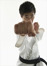 Asian male karate black belt punching