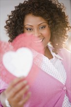 African American woman holding valentine