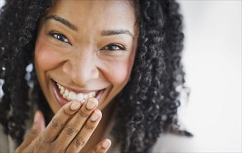 Laughing mixed race woman