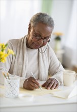Black woman writing letter