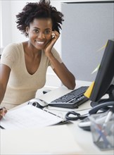 Black businesswoman working at desk