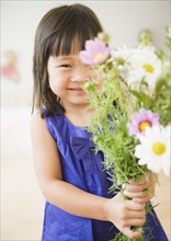 Korean girl holding bouquet of flowers