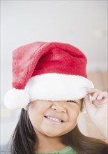 Korean girl wearing Santa hat