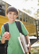 Caucasian boy waiting for school bus