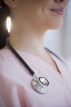 Stethoscope around Japanese nurse's neck