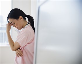 Japanese nurse with a headache