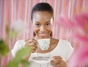 Black woman drinking tea