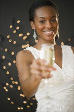 Black woman drinking Champagne