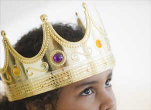 Mixed race girl wearing crown