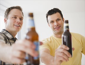 Men toasting together with beer