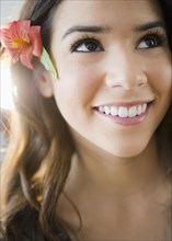 Hispanic woman with flower in her hair