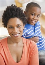 Smiling Black mother and son