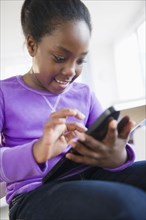Black girl using digital tablet