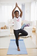 Black girl practicing yoga