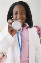 Black girl pretending to be a doctor