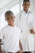 African American boy having checkup with doctor