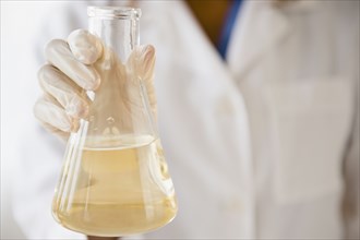 Cape Verdean scientist holding chemical in beaker