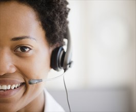 African American woman talking into headset