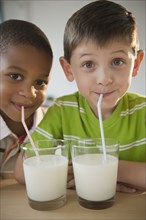 Boys drinking milk together