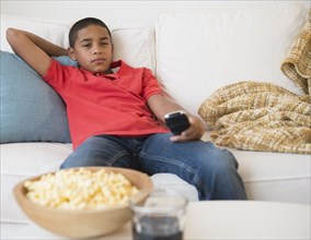 Hispanic boy watching television